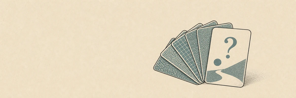 A fan of question cards with one prompt turned face-up